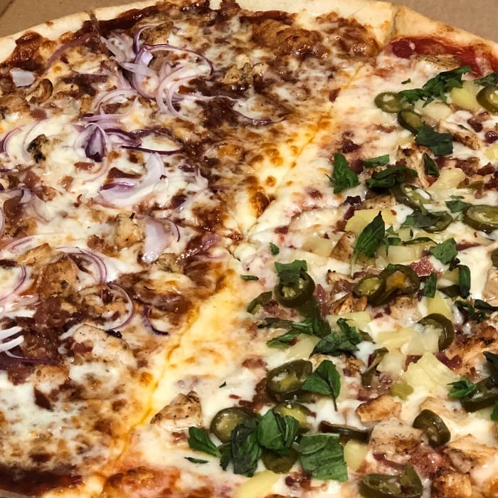 Spicy Hawaiian Chicken Pizza Slice.